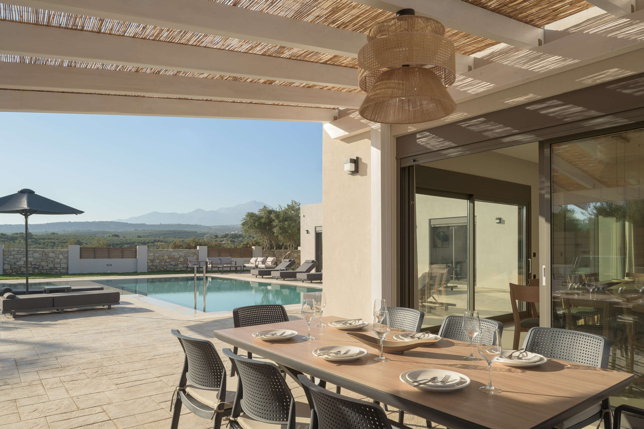 Dine outdoors with loved ones, surrounded by peaceful gardens and olive-scented air.